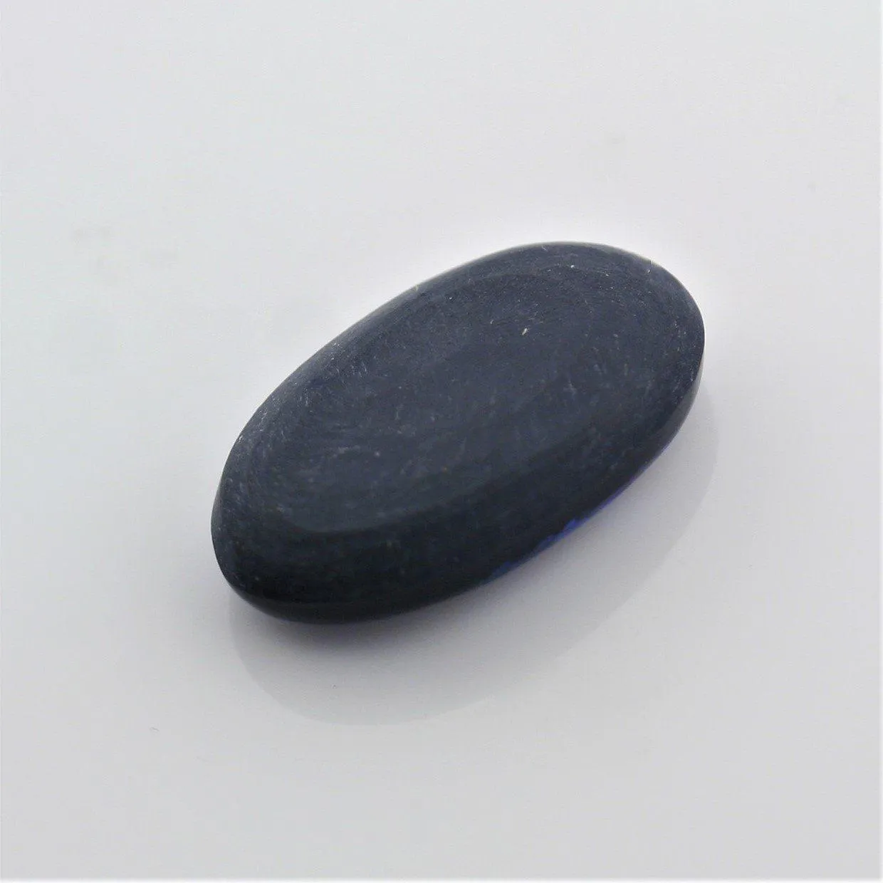 5.44 carat Black Opal Oval Flat Cabochon Blue Play of color