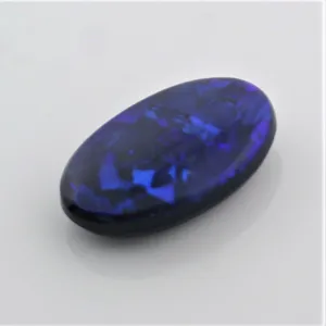 5.44 carat Black Opal Oval Flat Cabochon Blue Play of color